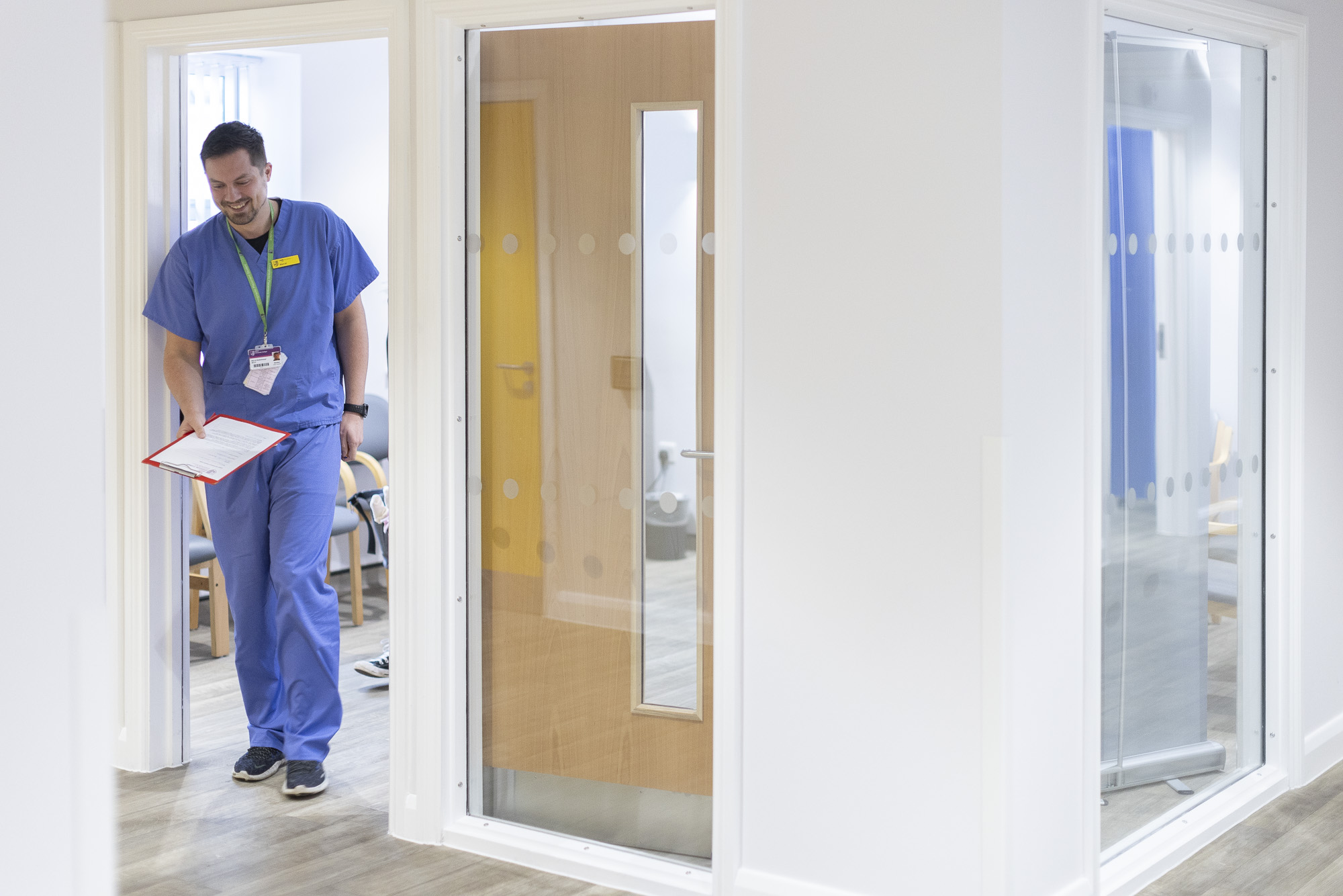 Chiropractic placement student walking out of waiting room at IRC