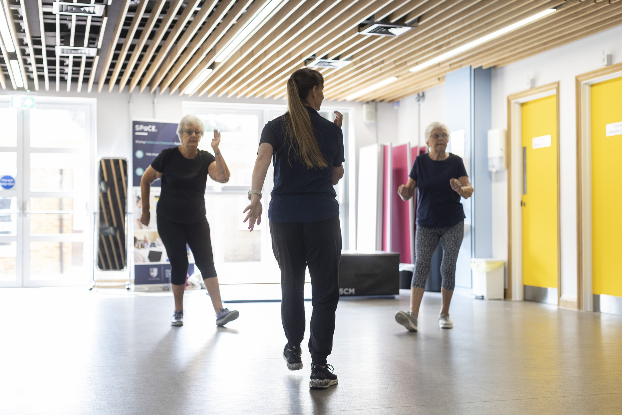 two patients at guided exercise class