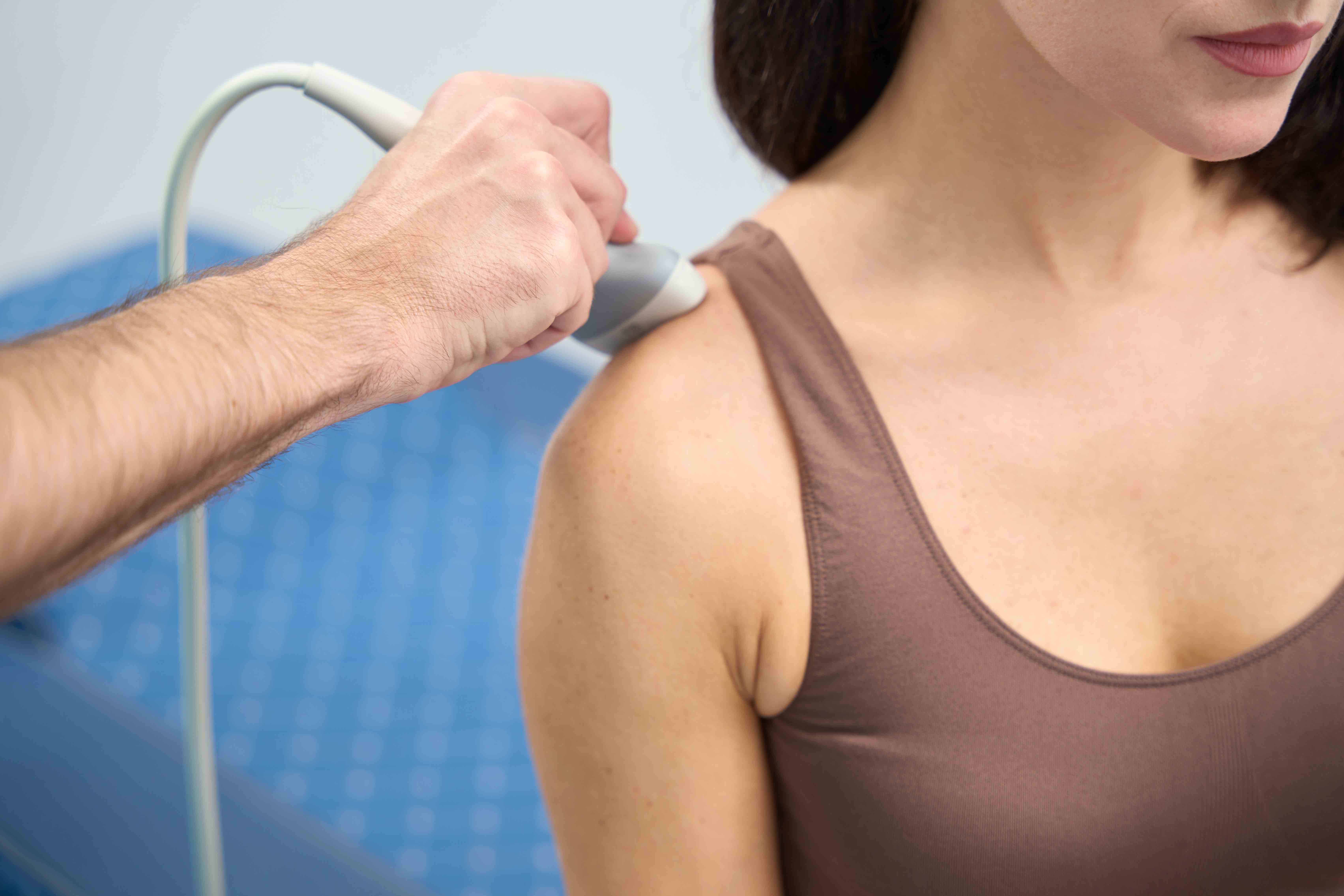 Young Woman having ultrasound scan on shoulder