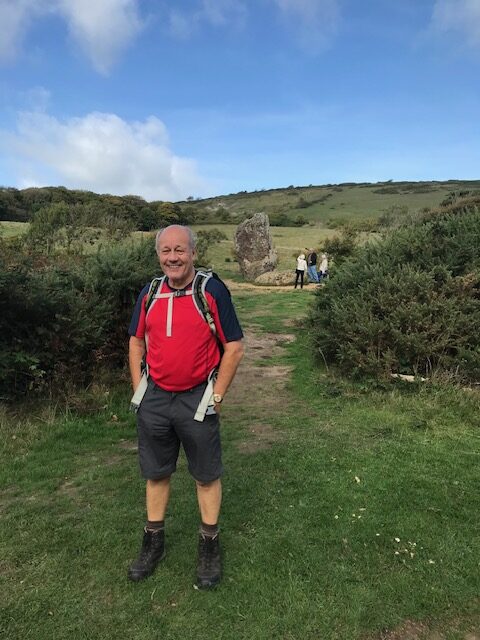 Man standing proud on a walk in the UK living an active lifestyle