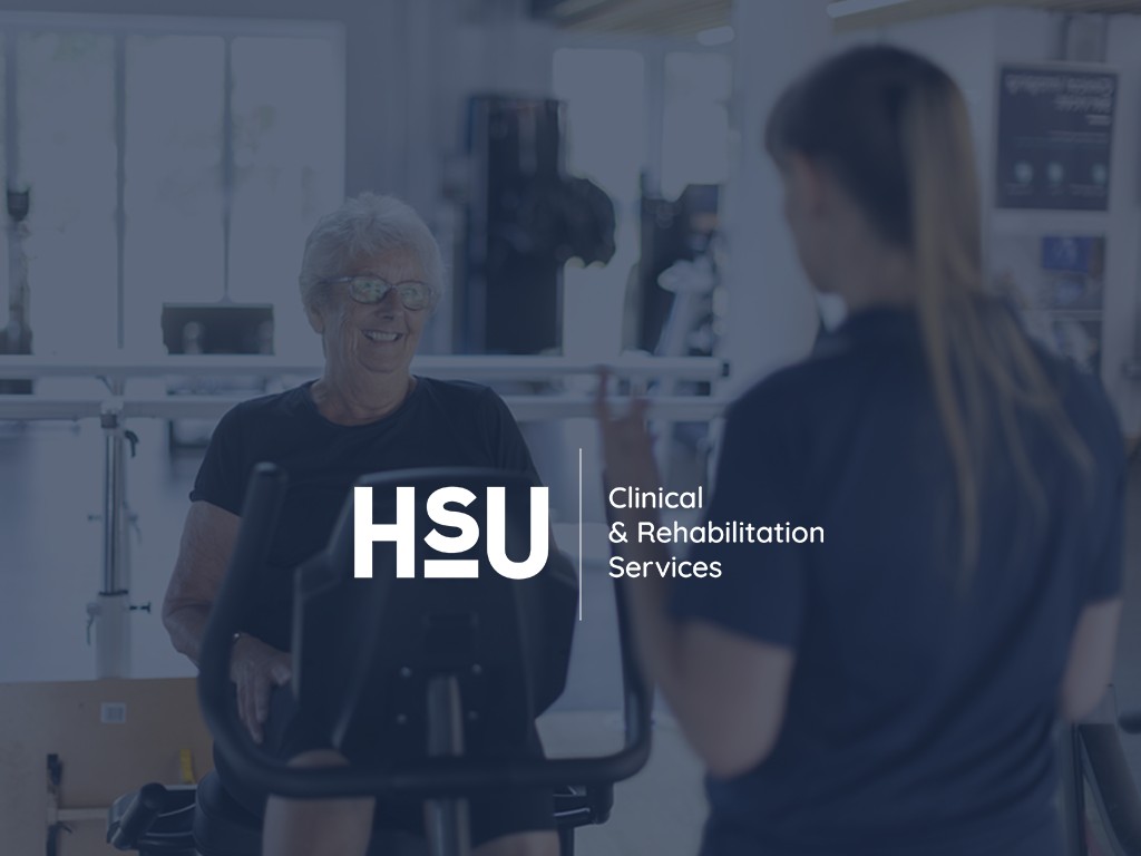 Older female talking to clinician blue over lay logo on top reads: HSU Clinical & Rehabilitation Services