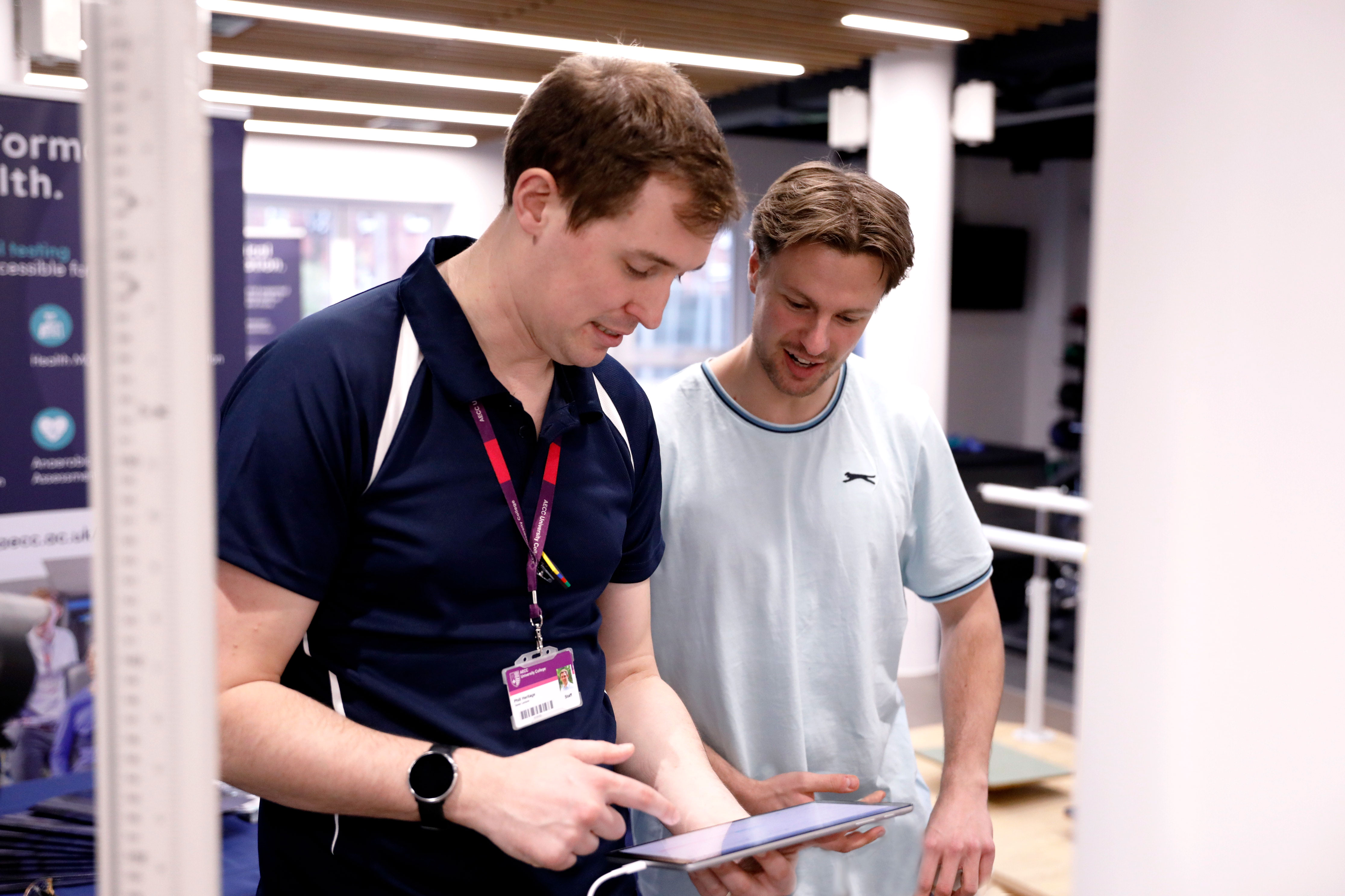 young male physiotherapist working with young male patient