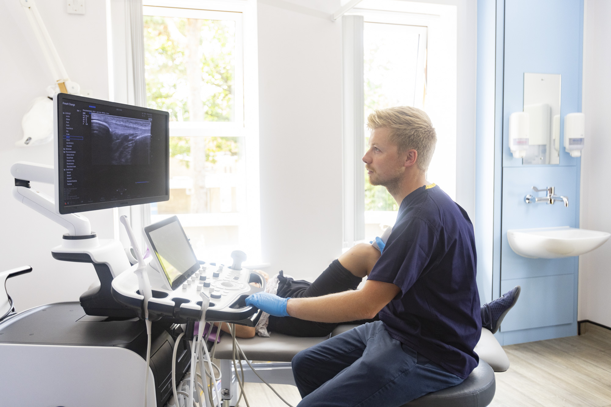 Sonographer taking an ultrasound image