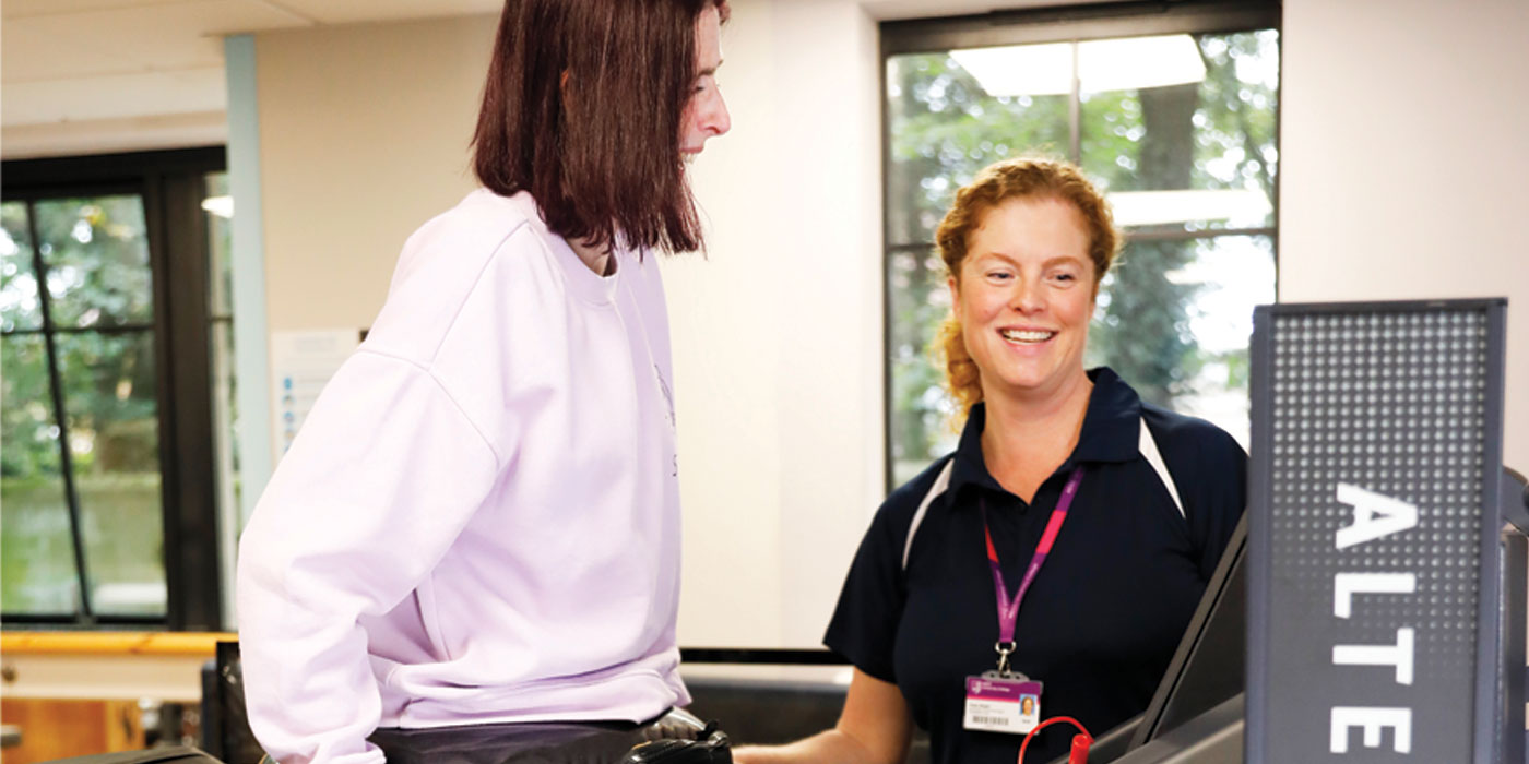 clinician with her patient using the Alter G treadmill