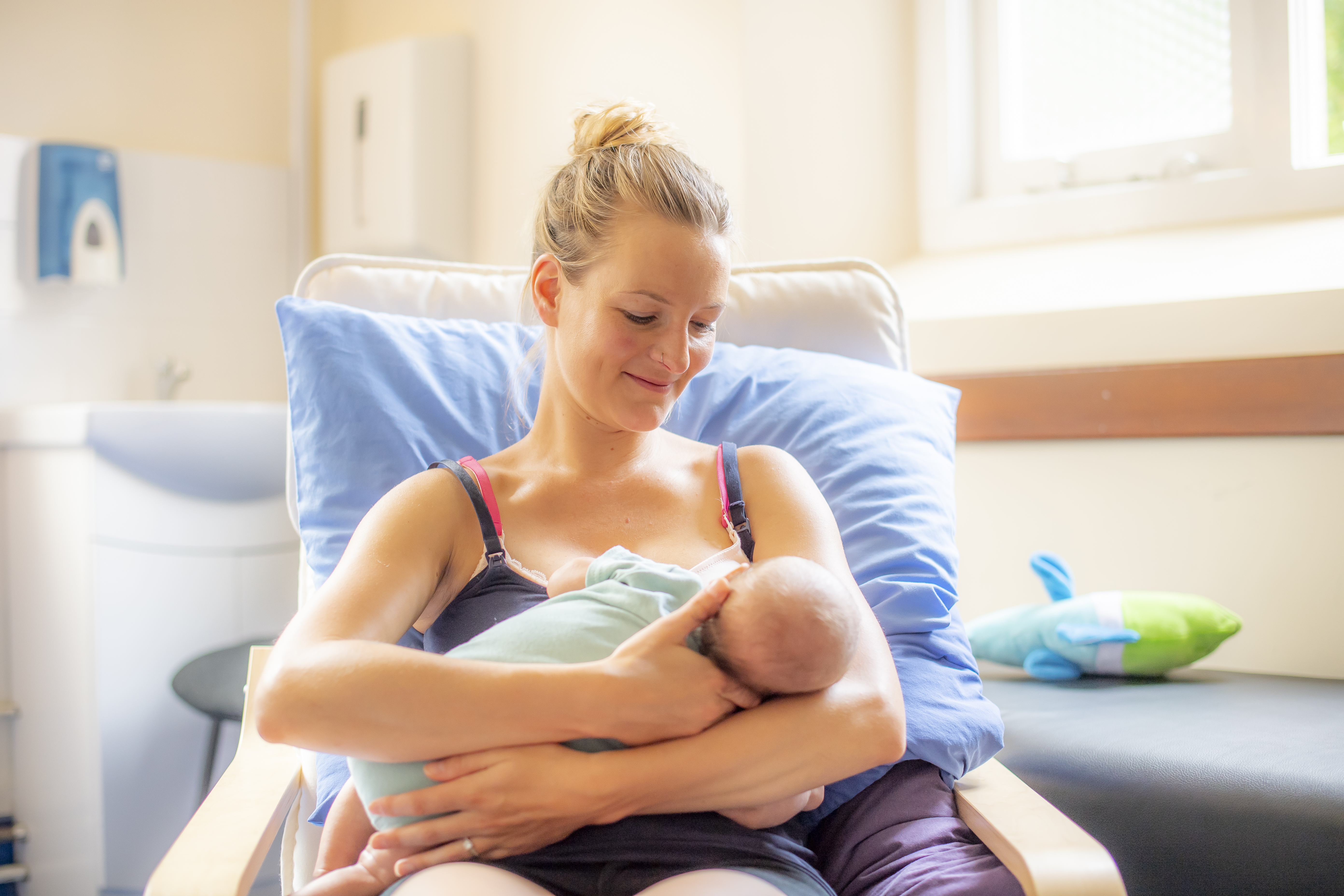 young mother breastfeeding her baby