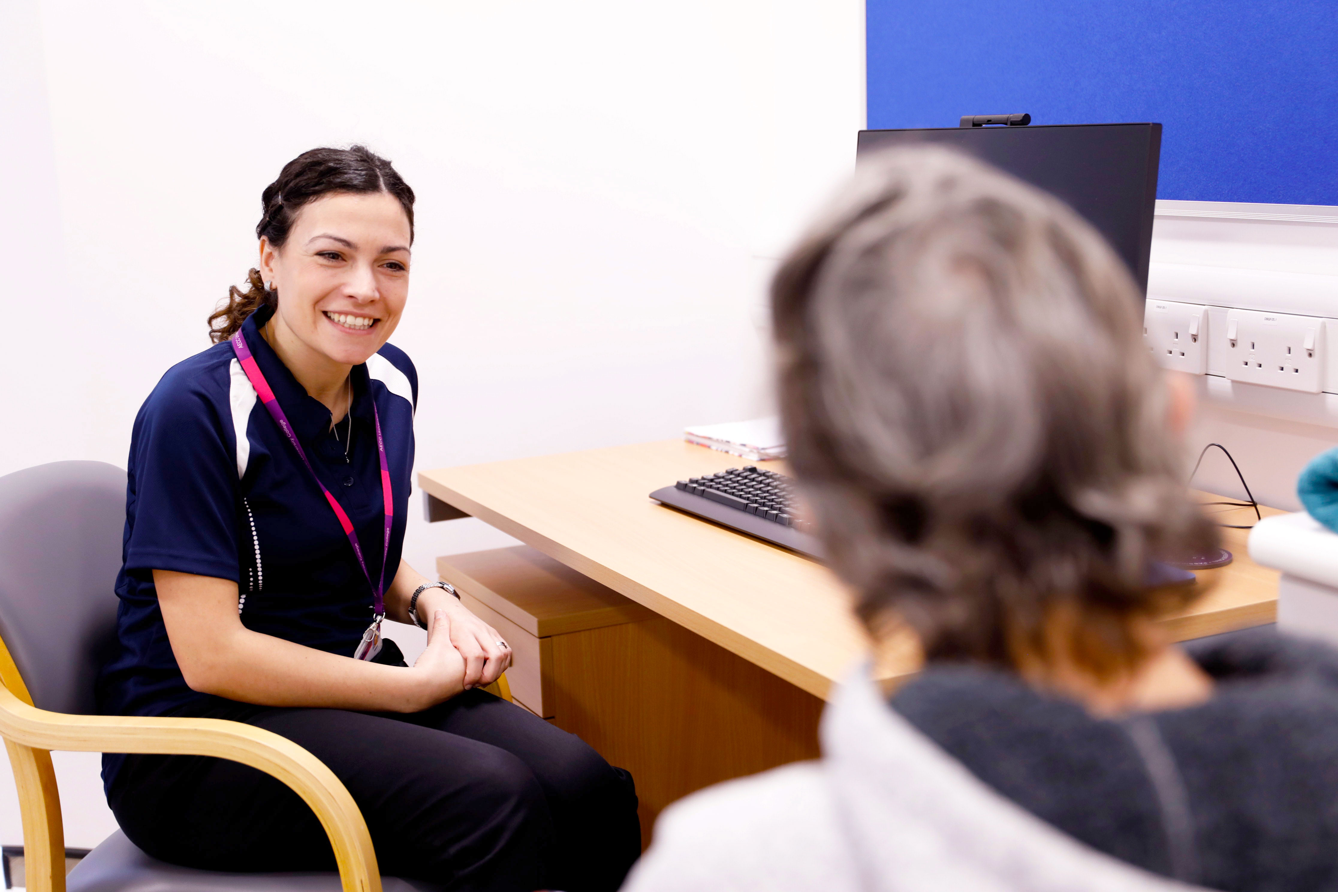 clinician with her patient during a consultation