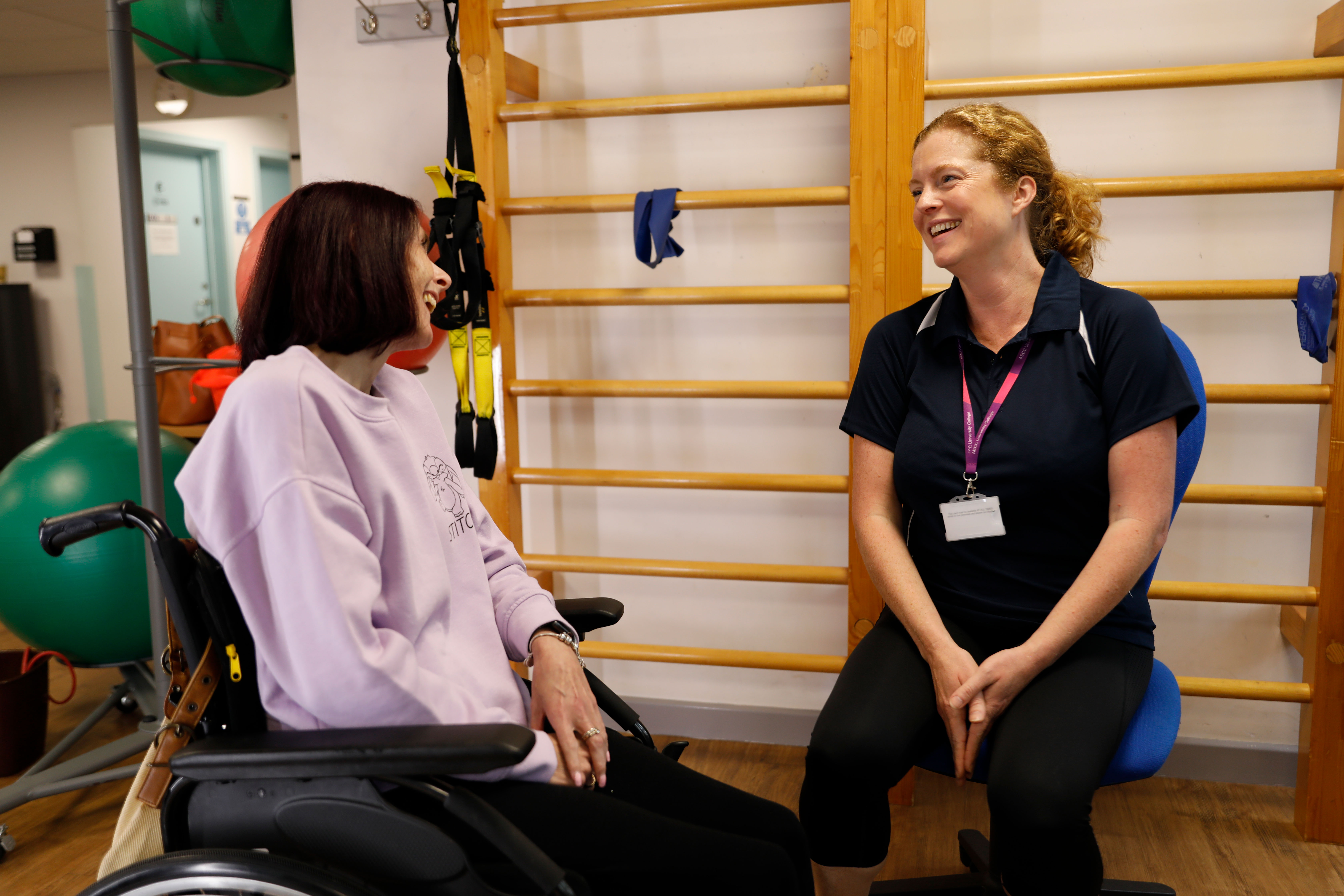 clinician speaking with lady in a wheelchair