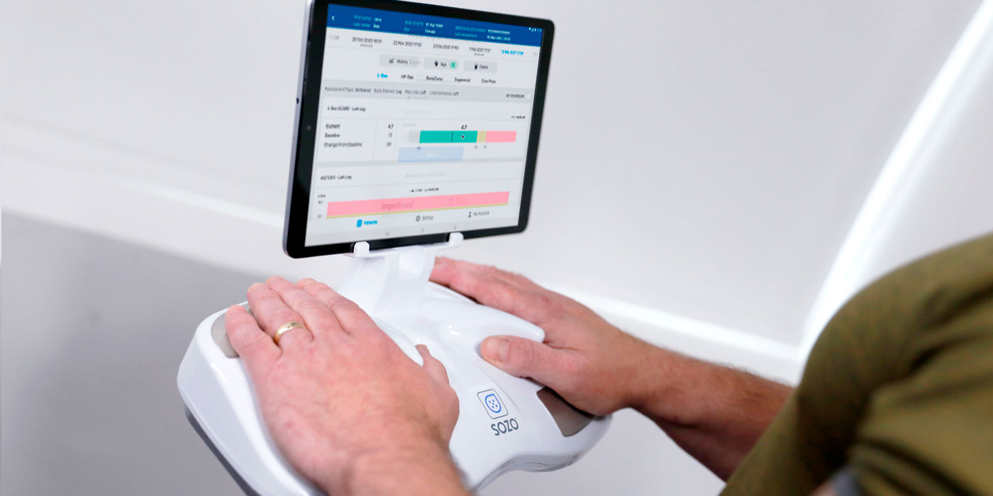 Man with his hands on a Sozo Hyrdospectrometer