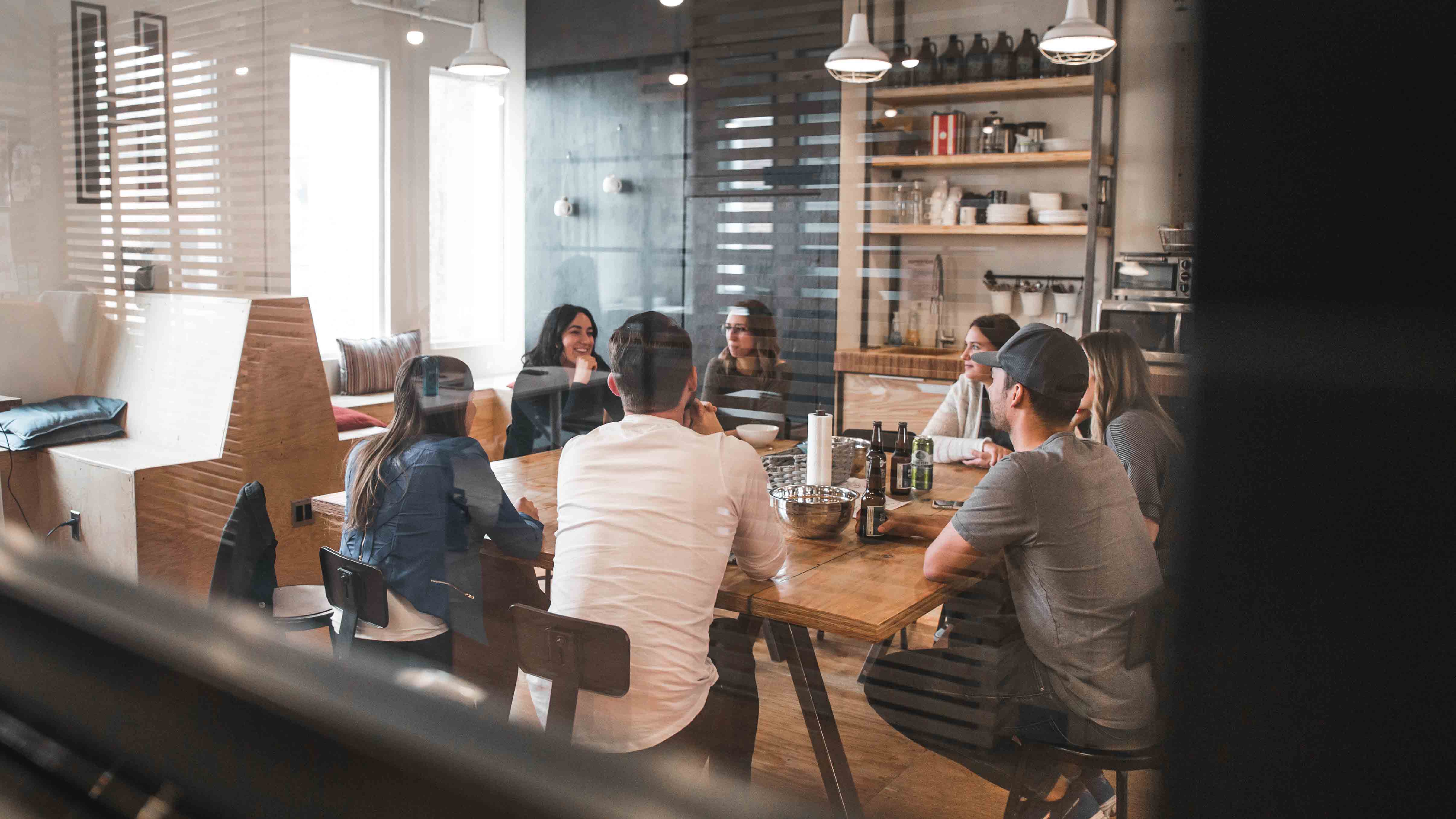 People having a meeting in a room with large table