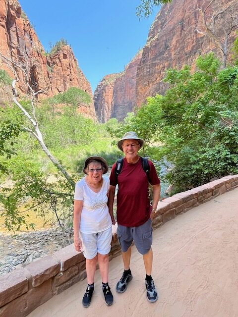 Man and his wife on outdoors holiday enjoying being active outside