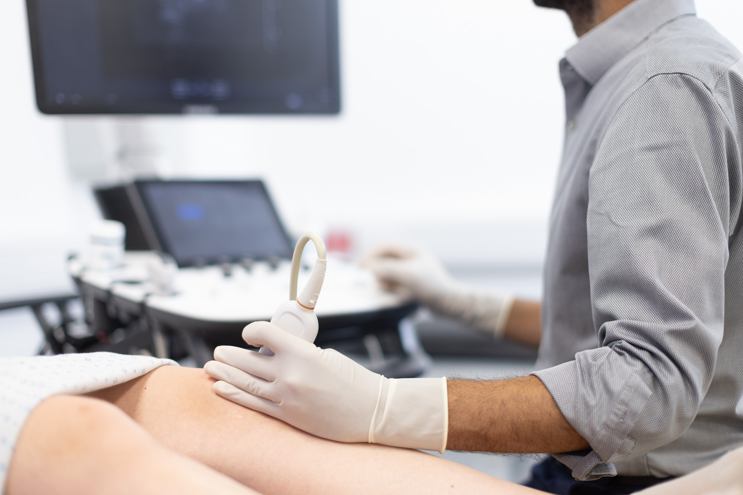 Close up of an ultrasound being done on a knee