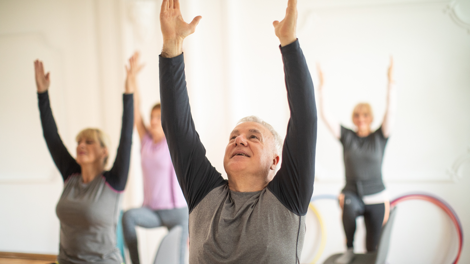 older adults in a chair based seated exercise class